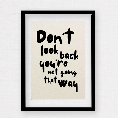 Custom script wall print with the words don’t look back you’re not going that way on a light natural stone looking background by Rock LV